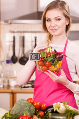 Woman holding shopping backet with vegetables