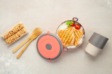 Healthy lunch at office workplace. Takeaway lunch boxes with nutrition food - fish, vegetables and...
