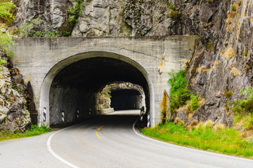 Road with tunnel in mountains Norway
