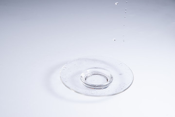 empty transparent glass dish on white acrylic sheet background stock photo