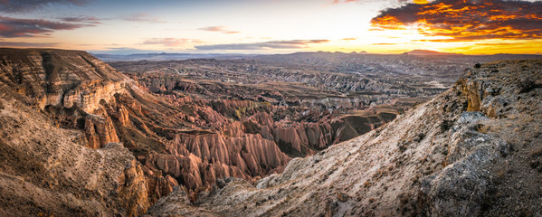 HDR Panoramic dramatic sunrise over the red and rose valleys with aerial view down from canyon. Textures and beautiful Capapdocia landscape. Background image.