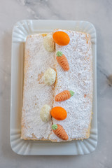 home made Easter sponge roll with carrots on a table