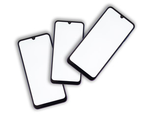 Three smartphones lie on one another with a white display on a light isolated background.