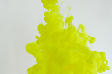 Blurred and focus green poster color dissolving in water for abstract and backgorund concept.