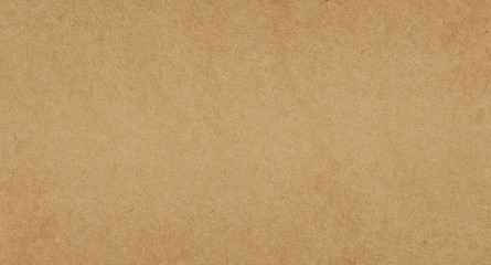 Brown paper or cardboard texture background.