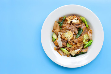 Stir fried flat noodle and pork with soy sauce. Top view