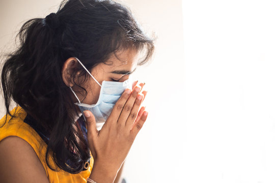 COVID-19 Coronavirus Portrait Young Asian Indian Girl Wearing Protective Mask Sneezing. Protection From Covid 19 Isolated On White Background. Girl Suffering From Fever, Omicron Cases 