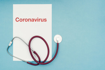 Coronavirus, covid-19. The inscription coronavirus on a blue background. Self-isolation and quarantine, personal protective equipment, phonendoscope and stethoscope.