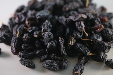 dry raisins on a white table