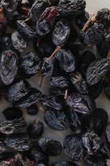 dry raisins on a white table