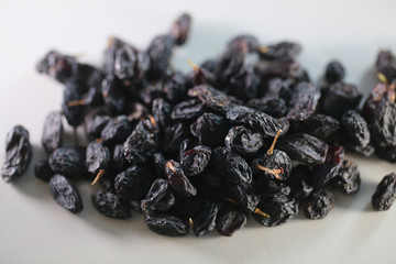 dry raisins on a white table