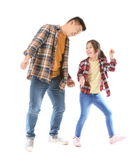 Fototapeta premium Happy Asian man and his little daughter dancing on white background