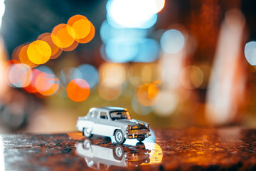 Moskvich 401 on the table, glowing background