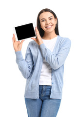 Beautiful young woman with tablet computer on white background