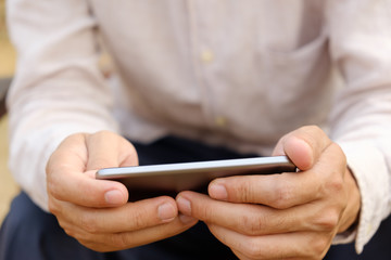 The man is using the phone.