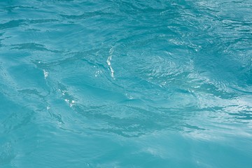 Surface of a light blue swimming pool
