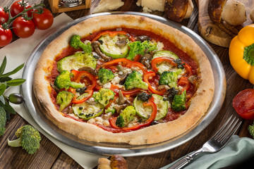 Vegetarian pizza with broccoli, pepper, mushrooms
