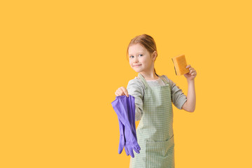 Little girl with sponge and rubber gloves on color background