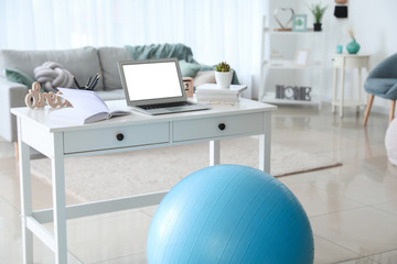Fitness ball near workplace at home