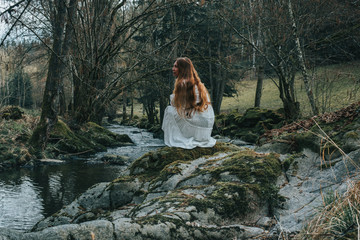 Girl by the creek