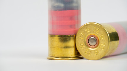 12 gauge shotgun ammunition on a white background