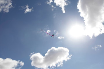 Fototapeta na wymiar Skydiver in a bright blue sky