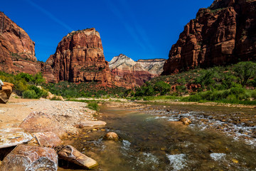 Southwest usa Zion National Park The main part of the park is Zion Canyon surrounded by the walls of the Deertrap, Cathedral and Majestic Mountain mountains. The Virgin River flows through the canyon.