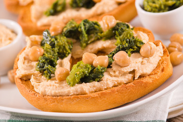 Friselle with turnip tops and hummus.