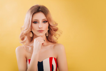 Beautiful, young model blonde close-up portrait. Girl with professional makeup and hairstyle,...