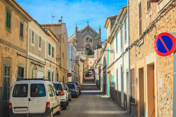 Empty street in Arta with Transfiguracio del Senyor church in the background - Mallorca, Spain