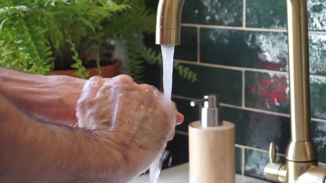 Washing hands tutorial. Coronavirus hygiene and prevention. Video in real time with running water.