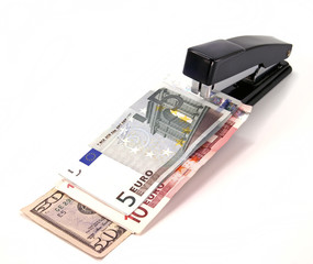 stapler and different money