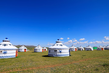 Mongolian yurt on the grassland,in the background of blue sky an