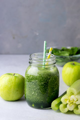 Glass Jar of Healthy Green Smoothie Detox Drink wirh Green Apple Celery and Raw Spinach Diet...
