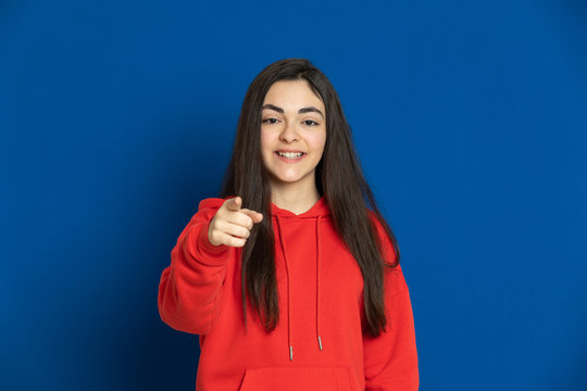 Brunette young girl with a red jersey