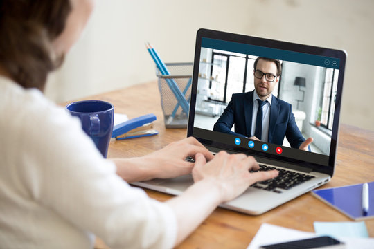 Laptop Screen View Confident Male Boss Leader Holding Videoconference Business Negotiations With Female Partner Worker Employee Due To Coronavirus Covid19 World Outbreak Quarantine, Remote Online Job.