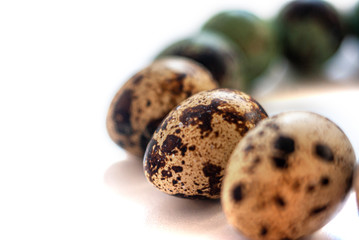 Obraz premium Minimalist easter concept. Natural dyed easter quail eggs blue and beige colour. In semicircle on isolated white background. Flat lay trendy easter.