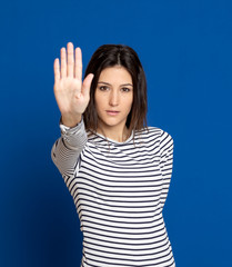 Fototapeta premium Brunette young woman wearing a striped T-shirt