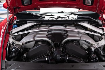 Powerful twelve cylinder engine mounted in coupe car.