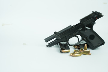 Black gun and ammunition on white background. Baretta 92