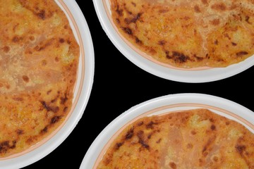 loo parantha in plate with black background three dishes