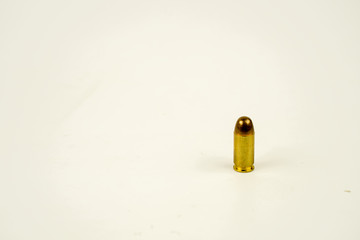 .45 acp bullet on white background.