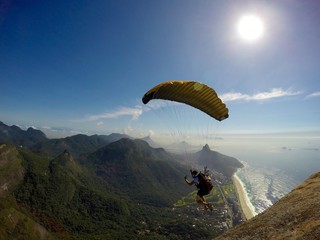 extreme paragliding launching over Rio de Janeiro, freedom concept