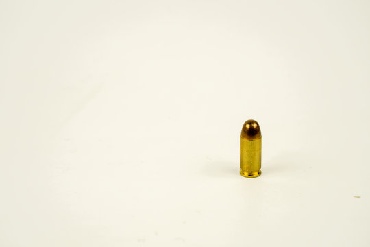 .45 Acp Bullet On White Background.