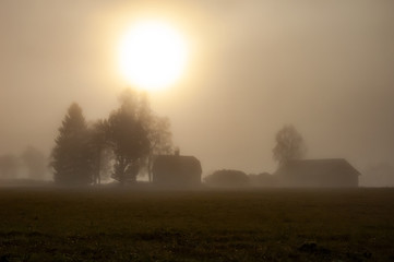 farm house and barn in heavy fog