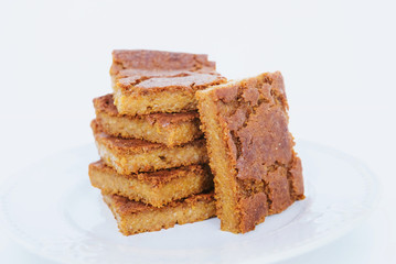 Freshly baked blondie brownie dessert slices, close up.