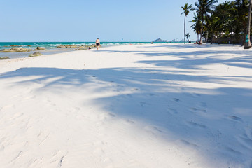 Ocean waves on the sandy beach for background, concept of the beach in the summer