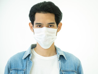 Protection against contagious disease, coronavirus.Asian Man wearing hygienic mask prevent infection,airborne respiratory illness as flu, Covid-19 indoor studio shot isolated on white background.