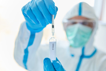 Medic with syringe with Covid-19 vaccination