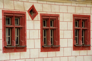 Obraz premium Three old red vintage windows
